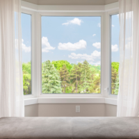 bay window looking out onto greenery trees