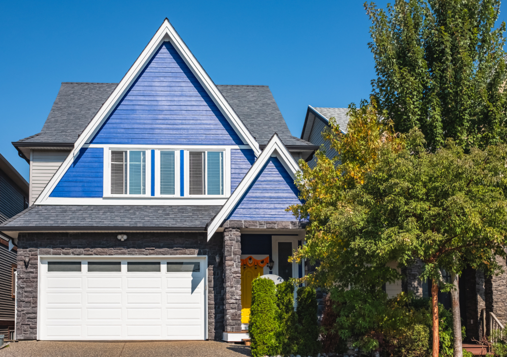 New Braunfels home with bright blue siding in the sunlight