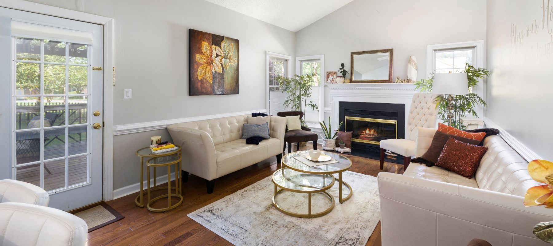Bright and cozy living room in Shavano Park, TX, with neutral-toned furniture, a fireplace, and natural light from multiple windows